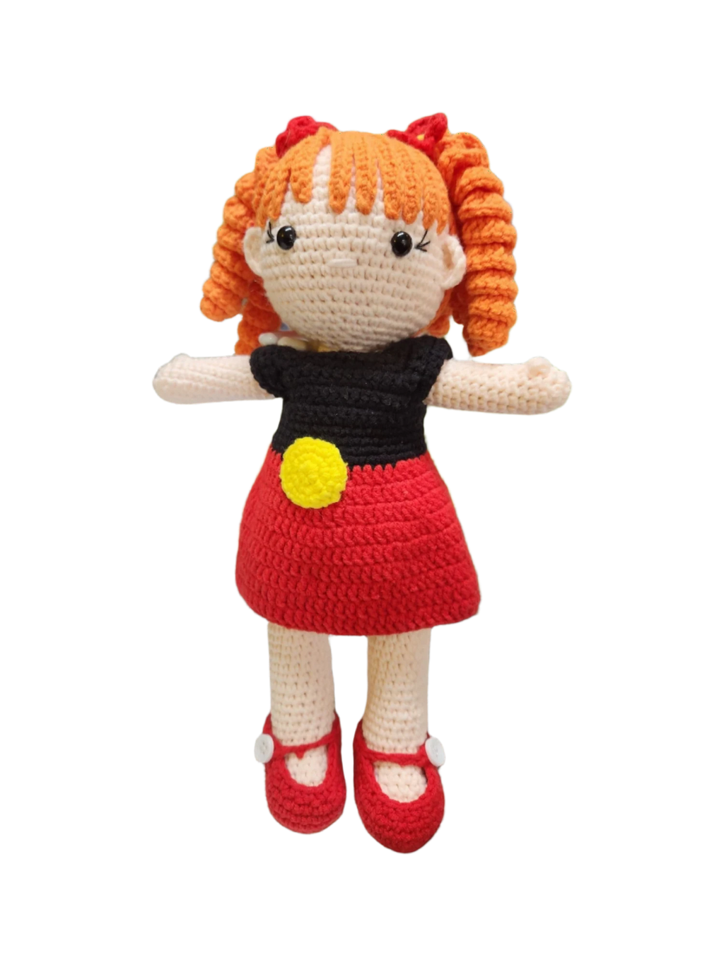 Suzie's Sunshine Dolls Alinta, a crochet doll with orange curly hair, wearing a red dress and black top with Aboriginal flag colours.