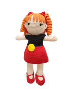 Suzie's Sunshine Dolls Alinta, a crochet doll with orange curly hair, wearing a red dress and black top with Aboriginal flag colours.