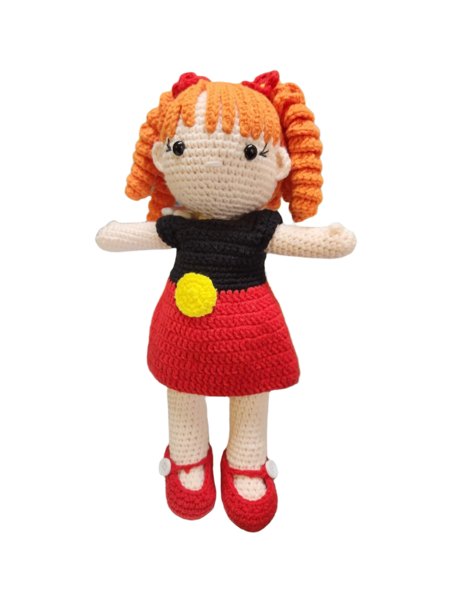 Suzie's Sunshine Dolls Alinta, a crochet doll with orange curly hair, wearing a red dress and black top with Aboriginal flag colours.
