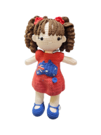 Suzie's Sunshine Dolls Mia, a crocheted doll with long brown hair, wearing a red dress with Australia flag applique and blue shoes.