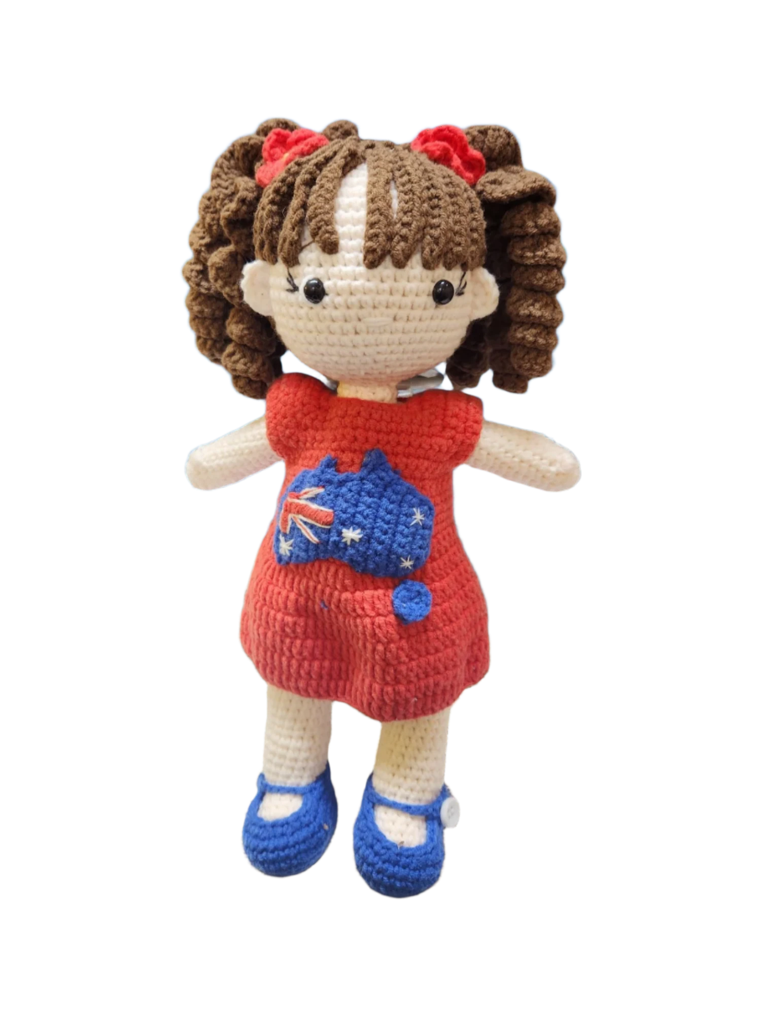 Suzie's Sunshine Dolls Mia, a crocheted doll with long brown hair, wearing a red dress with Australia flag applique and blue shoes.