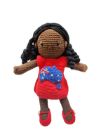 Suzie's Sunshine Dolls Mia, a crocheted doll with long black hair, wearing a red dress with the Australian flag and map appliqué.