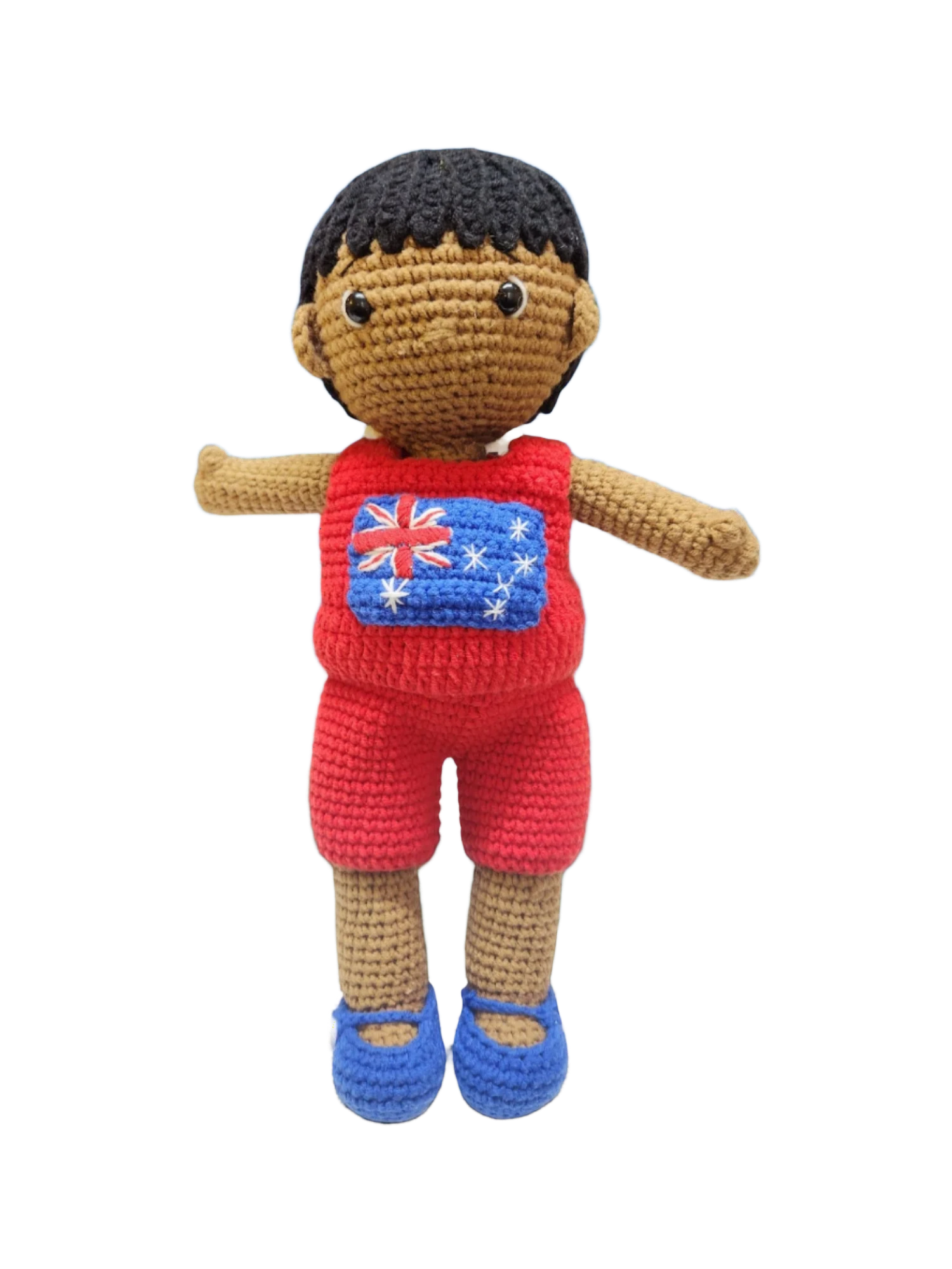 Suzie's Sunshine Dolls Jack, a crocheted doll with short black hair, wearing a red outfit with the Australian flag on the chest and blue shoes.