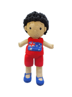 Suzie's Sunshine Dolls Jack, a crocheted doll with short black hair, wearing a red outfit with the Australian flag on the chest and blue shoes.