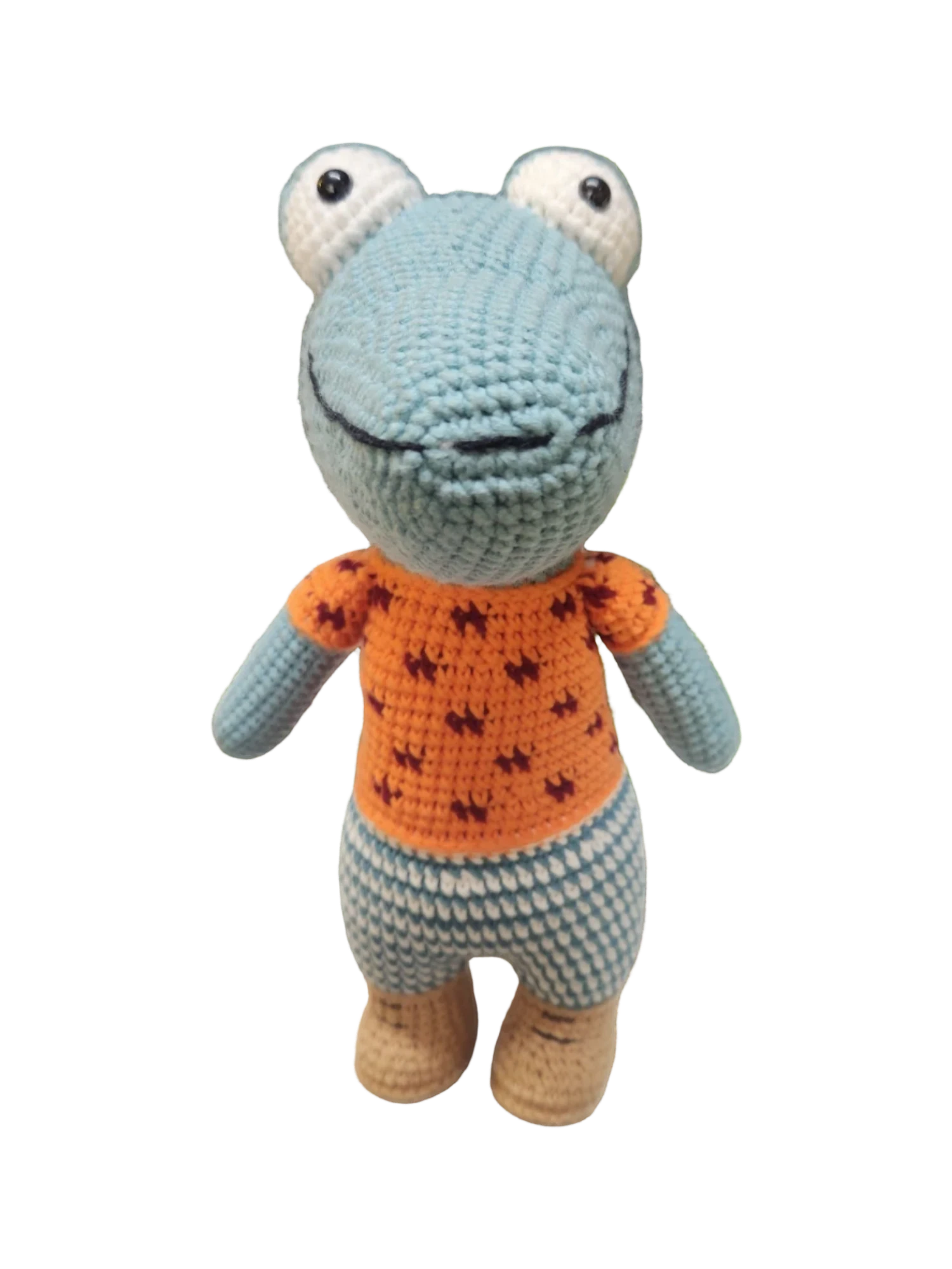 Suzie's Sunshine Dolls Calvin the Croc, a handmade crochet toy with blue snout, orange shirt, and checkered pants.