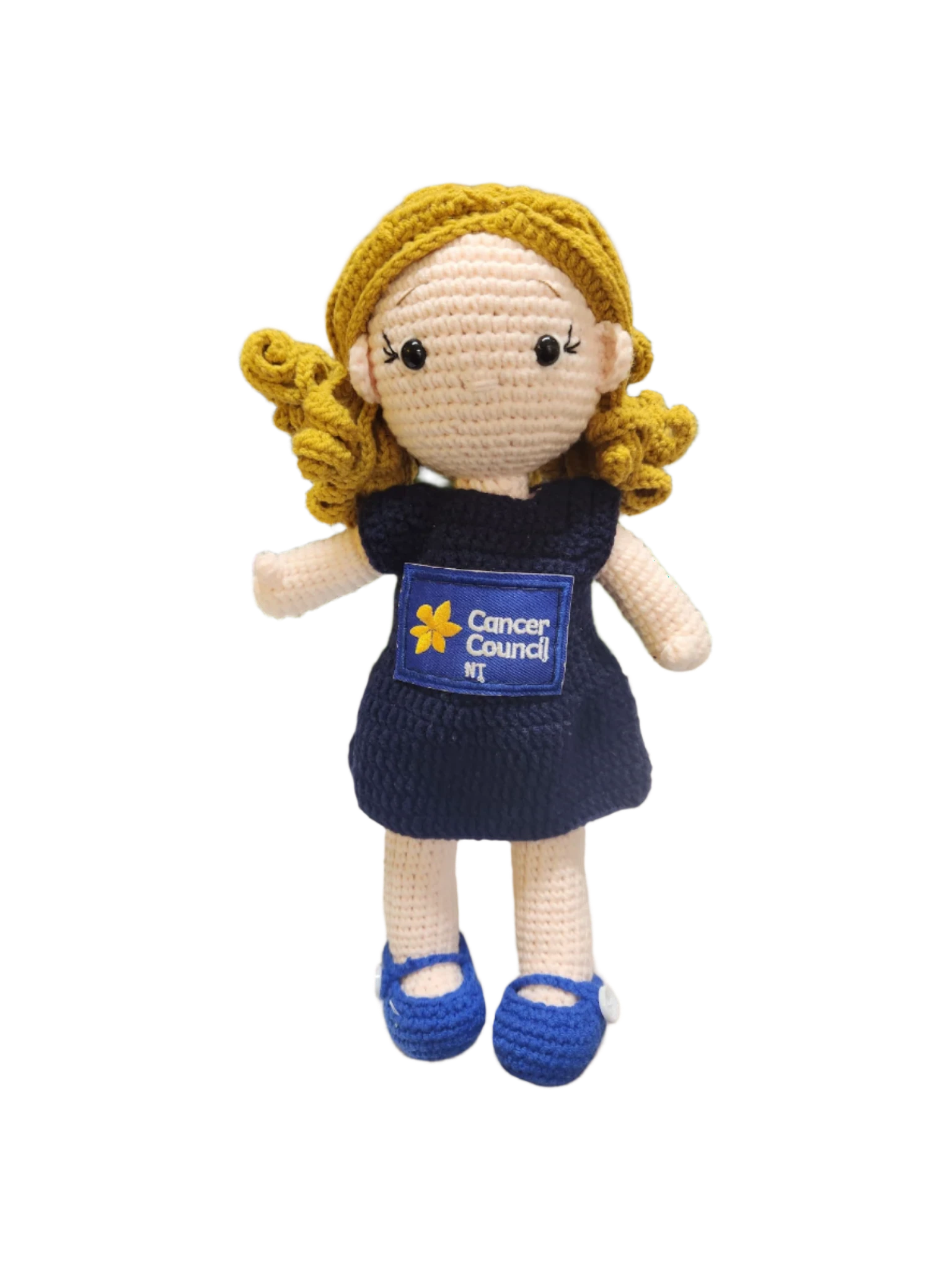 Suzie's Sunshine Dolls navy blue crocheted doll with blonde hair, wearing blue shoes and a Cancer Council NT patch.