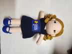 Suzie's Sunshine Dolls navy crocheted doll with Cancer Council NT patch and blue shoes. Educational toy.