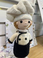 Suzie's Sunshine Dolls handcrafted crochet chef doll in white hat and uniform with black apron. Eco-friendly yarn.