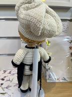 Suzie's Sunshine Dolls handcrafted crochet chef doll in white uniform, black apron, and tall hat. Eco-friendly yarn.