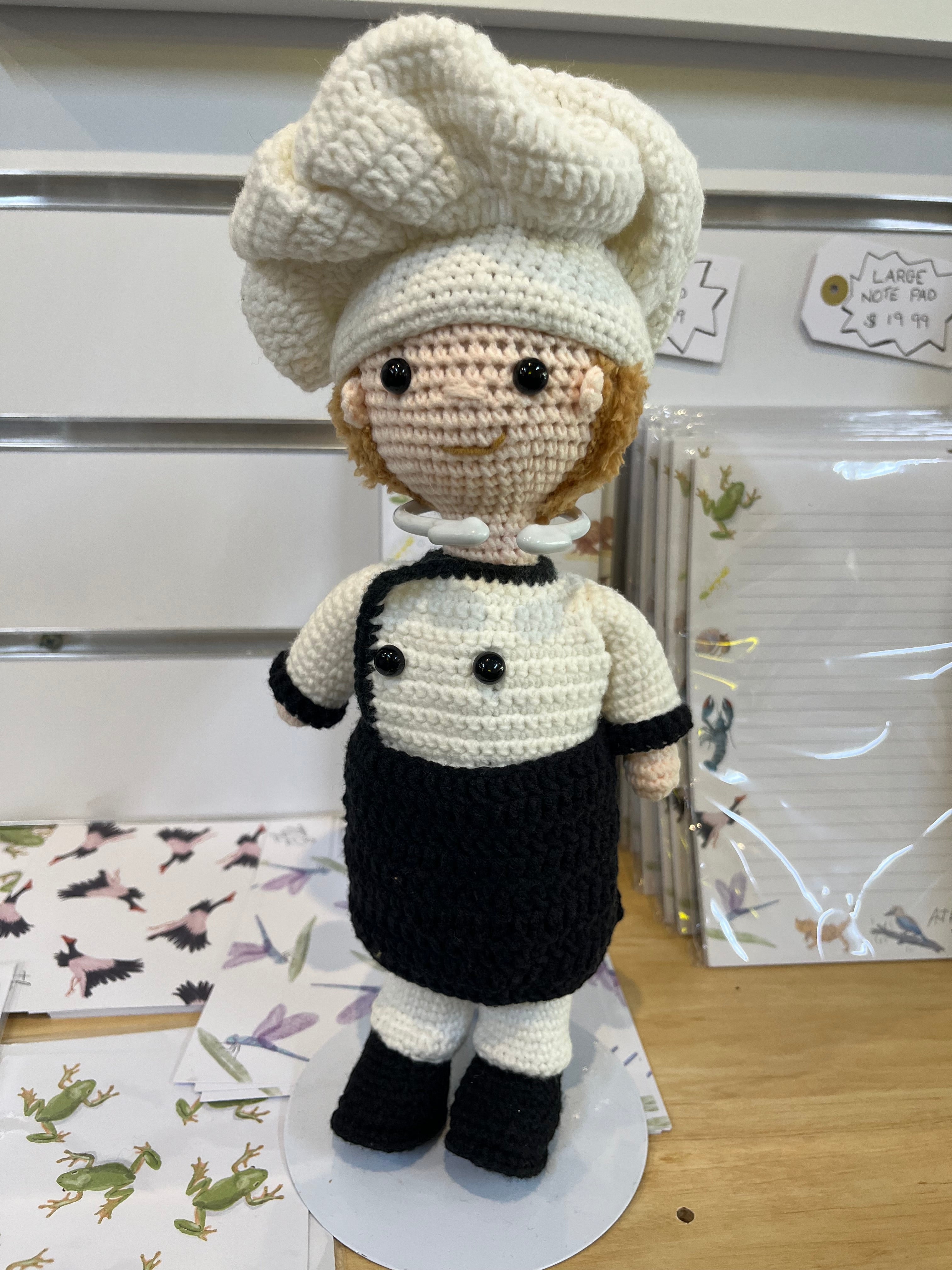 Suzie's Sunshine Dolls handcrafted crochet chef doll in white hat and uniform, black apron, 30cm tall.