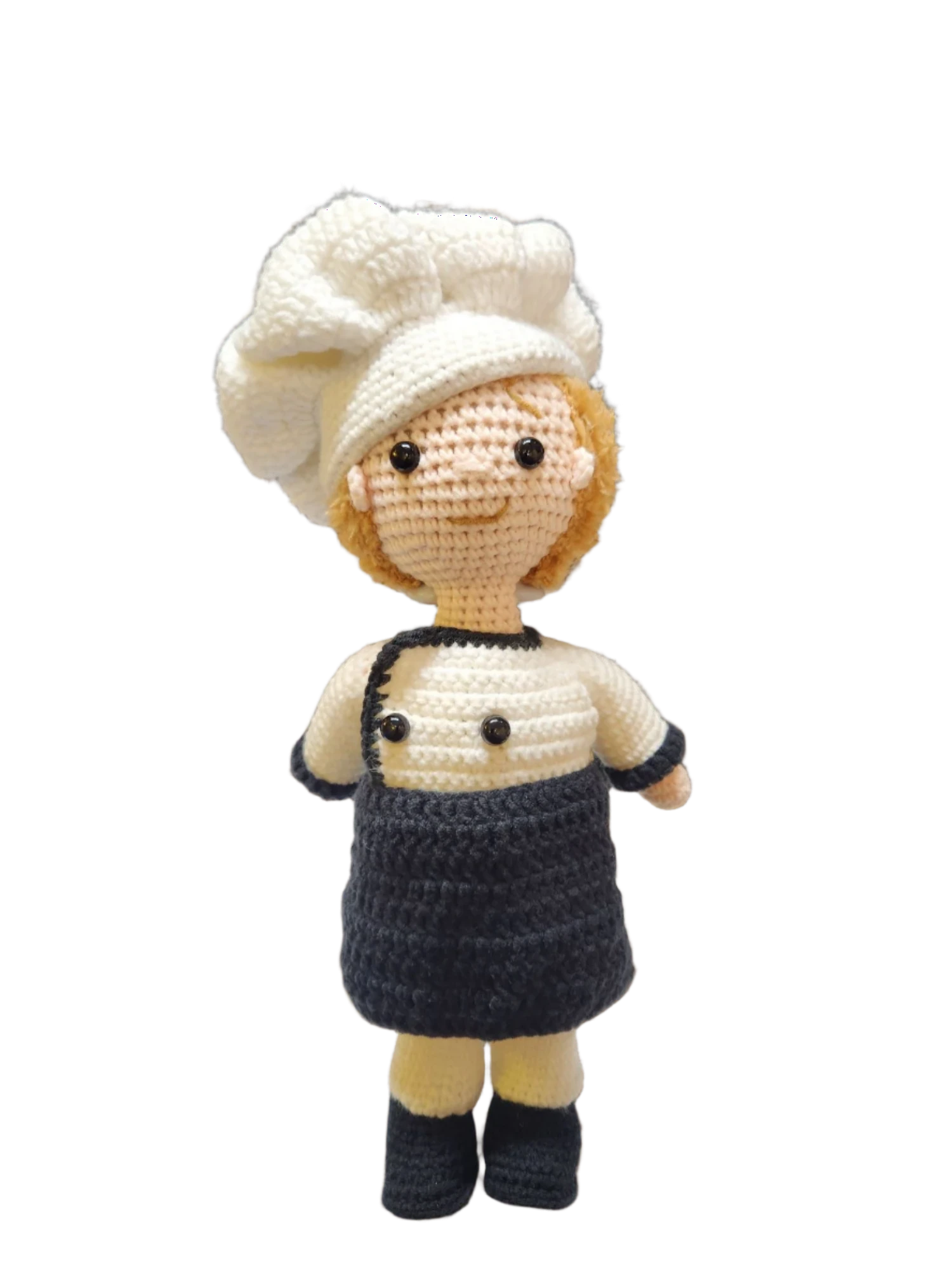 Suzie's Sunshine Dolls handcrafted crochet chef doll in white hat and uniform with black apron, 30cm tall.