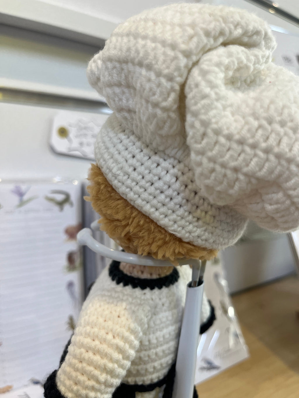 Suzie's Sunshine Dolls white crocheted chef doll with a tall hat and apron, perfect for imaginative play.