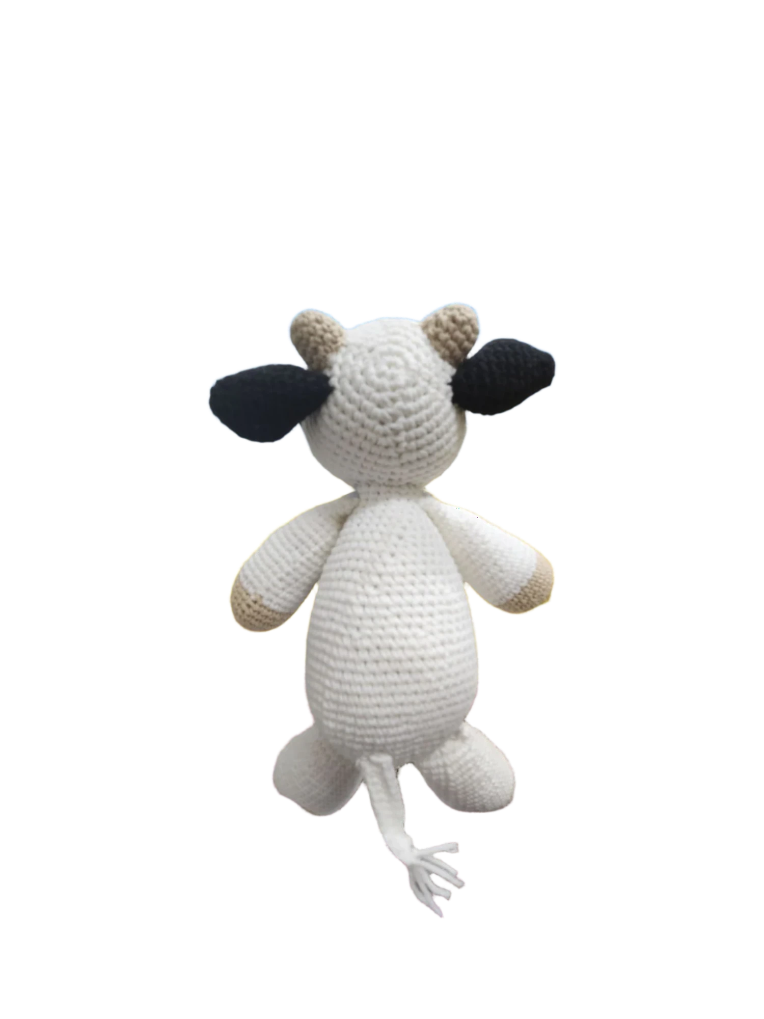 Suzie's Sunshine Dolls Daisy the Cow, a handmade crochet toy with white body, black ears, and tan accents. Perfect for play.