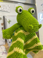 Suzie's Sunshine Dolls Kasabian the Croc lovey blanket, green and cream striped crochet with embroidered eyes.