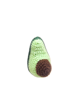 Suzie's Sunshine Dolls hand-crocheted avocado toy, light green with brown pit, made of cotton yarn.