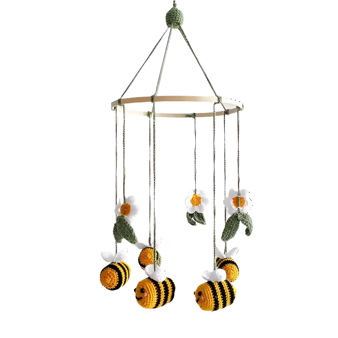 Suzie's Sunshine Dolls handmade crochet baby crib mobile with bees and flowers. Yellow and black bees with white wings, white flowers with yellow centers, and green leaves.