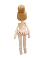 Suzie's Sunshine Dolls handmade crochet ballerina doll in a pink tutu and ballet slippers, with hair in a bun.