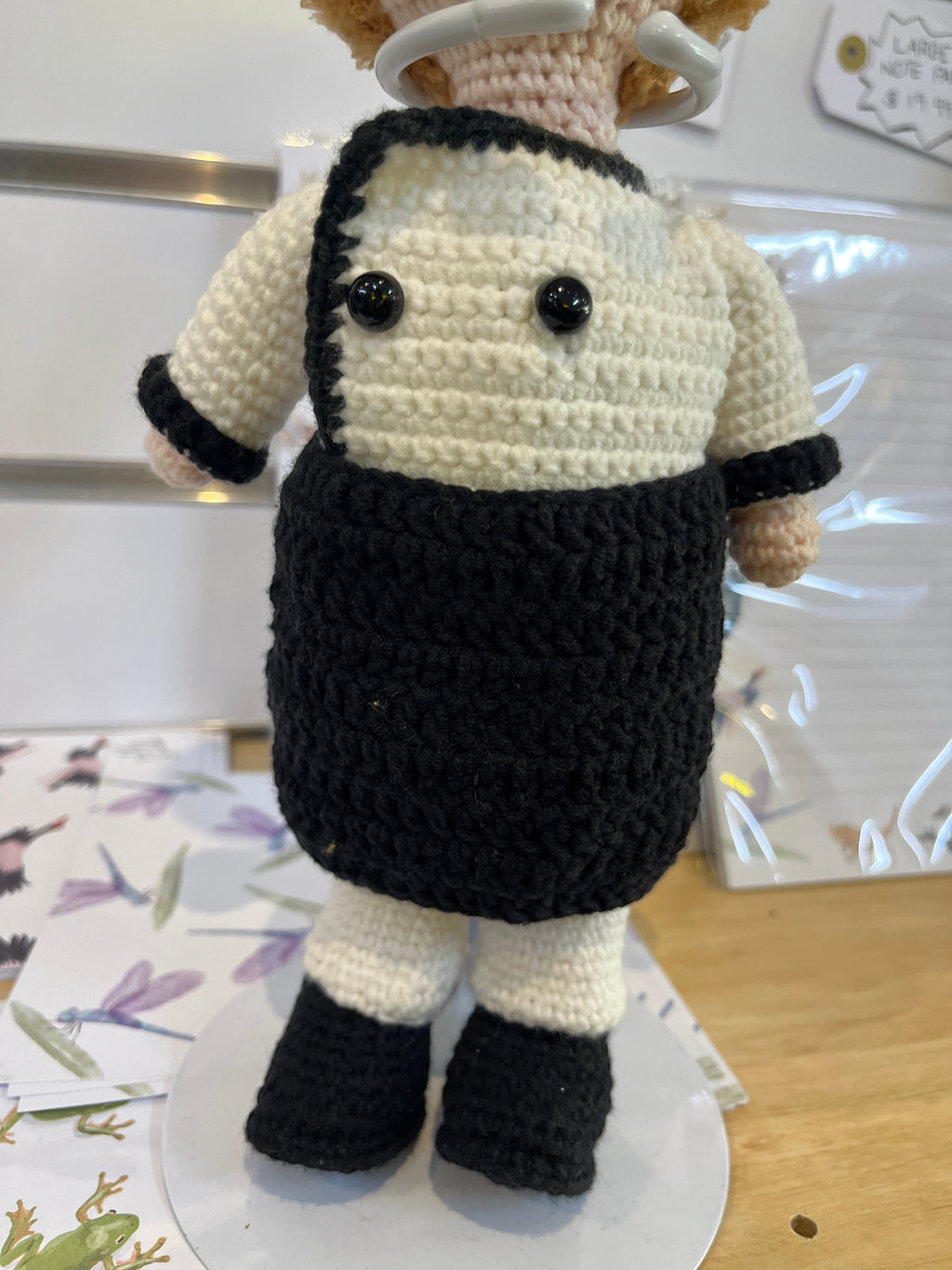 Suzie's Sunshine Dolls handcrafted crochet chef doll in black and cream uniform with black buttons and hat.