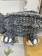 Suzie's Sunshine Dolls Kurtis the Croc plush toy, grey crochet with white toes and stitched smile. Handmade.