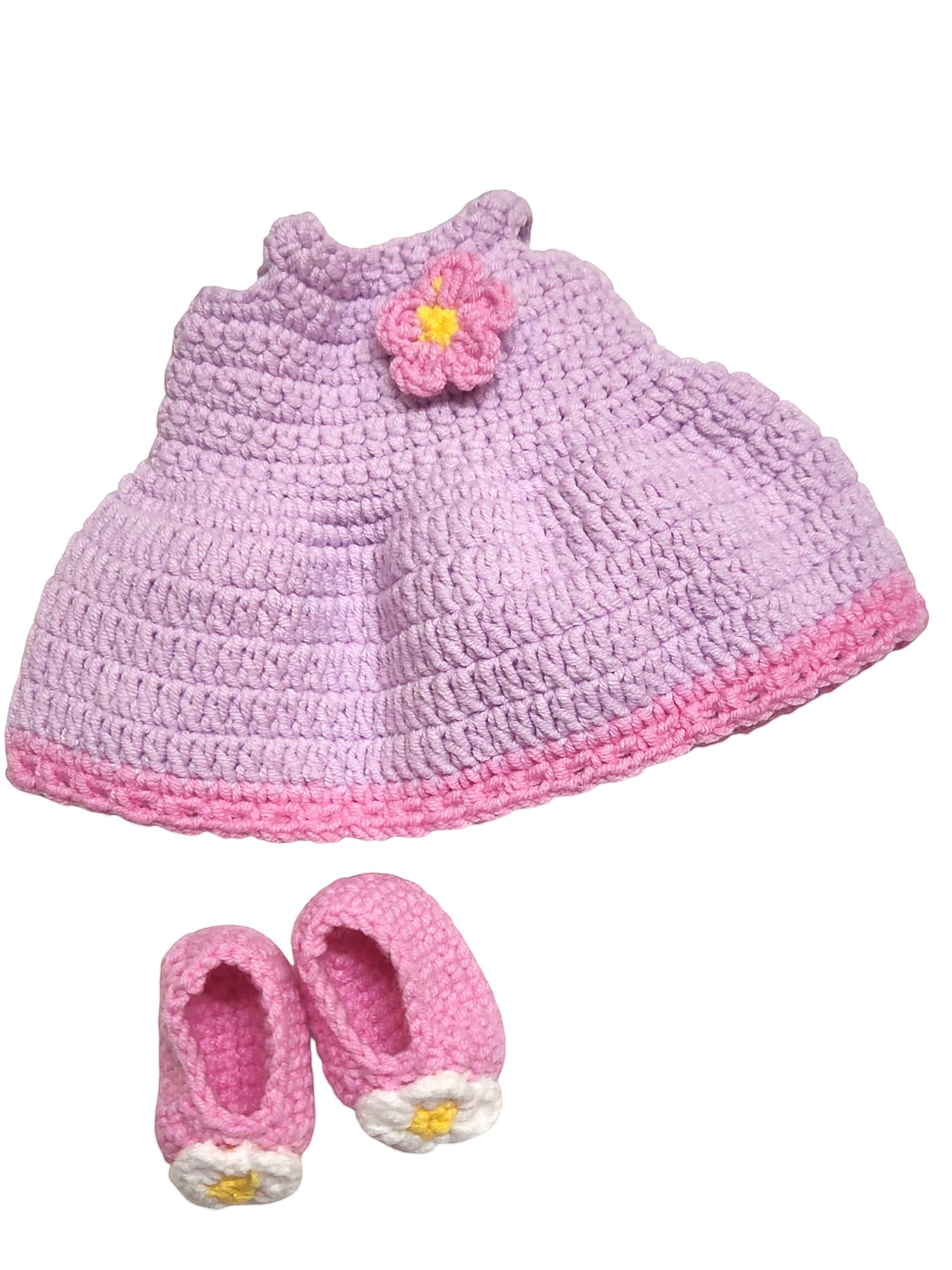 Suzie's Sunshine Dolls handmade lavender crochet doll dress with pink trim and flower, plus pink shoes with flower detail.