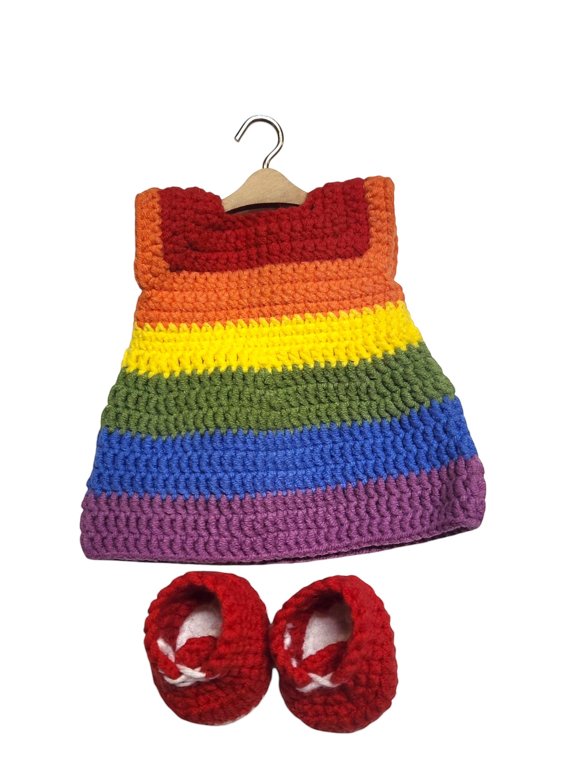 Suzie's Sunshine Dolls handmade crochet rainbow striped doll dress on hanger with red booties. Soft yarn.
