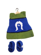 Suzie's Sunshine Dolls handmade crochet doll dress and shoes set in blue, green, and white with a star emblem.