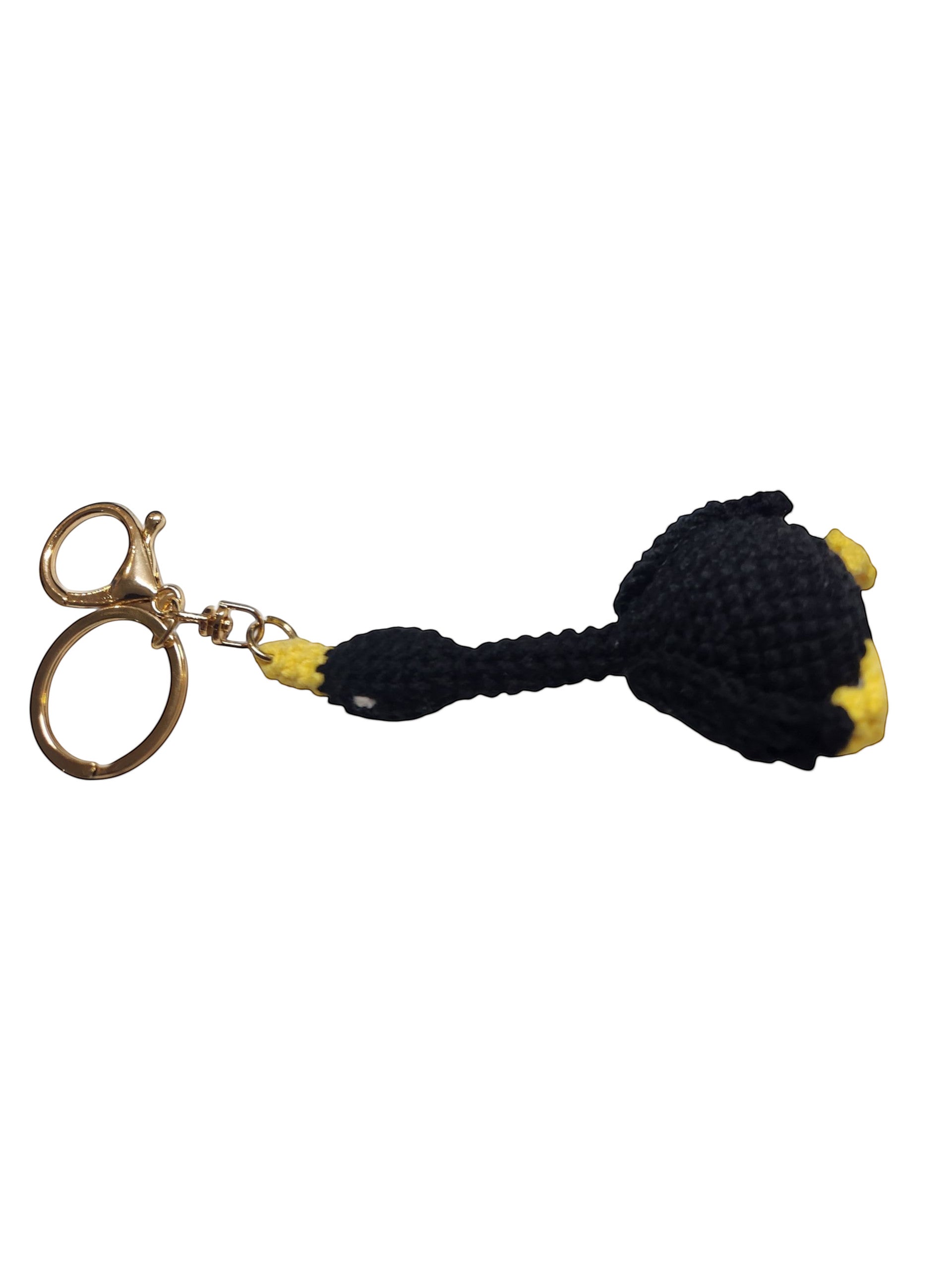 Suzie's Sunshine Dolls black and yellow crochet duck keychain with gold hardware. Handmade yarn accessory.