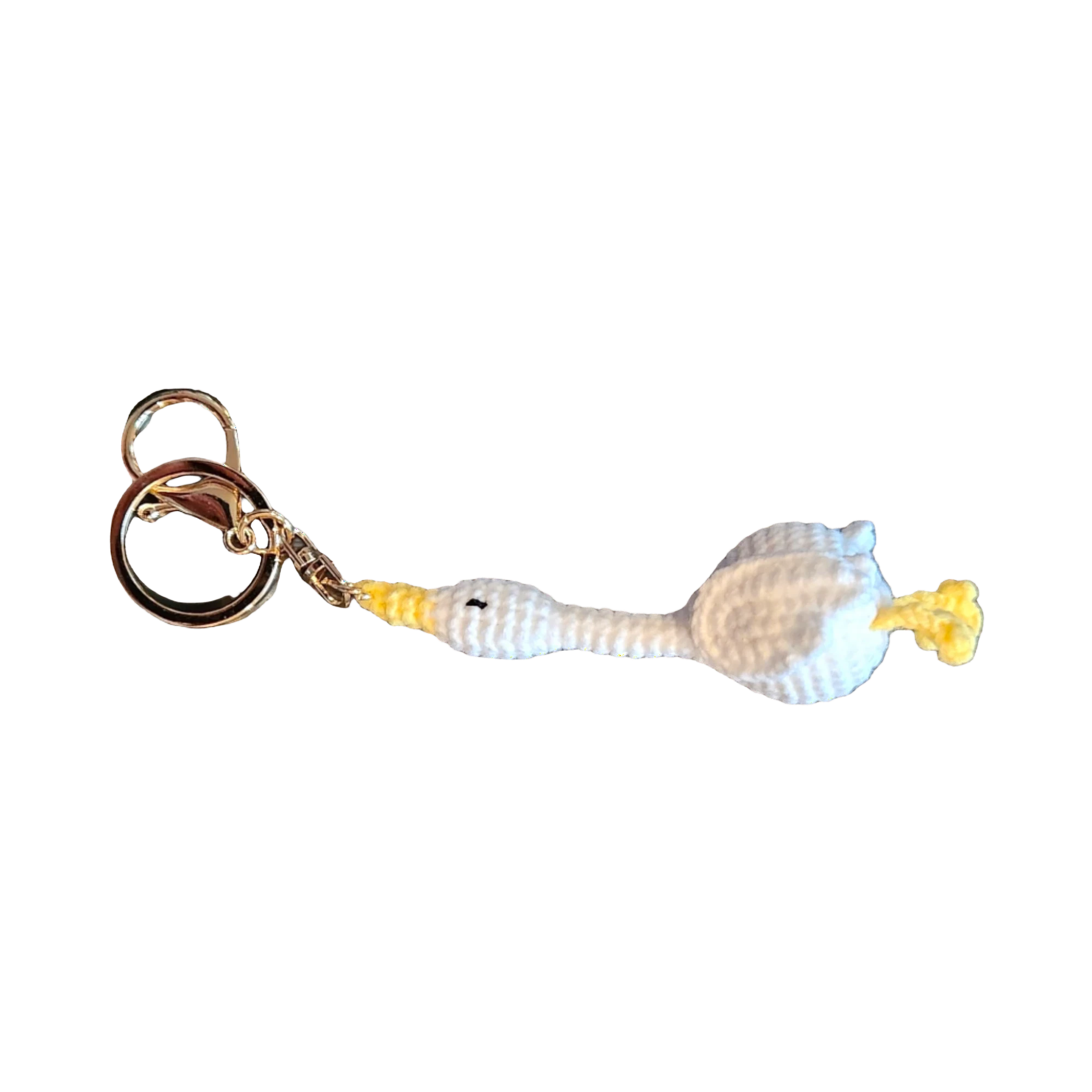 Suzie's Sunshine Dolls white crochet goose keychain with yellow beak and feet, attached to a gold keyring.