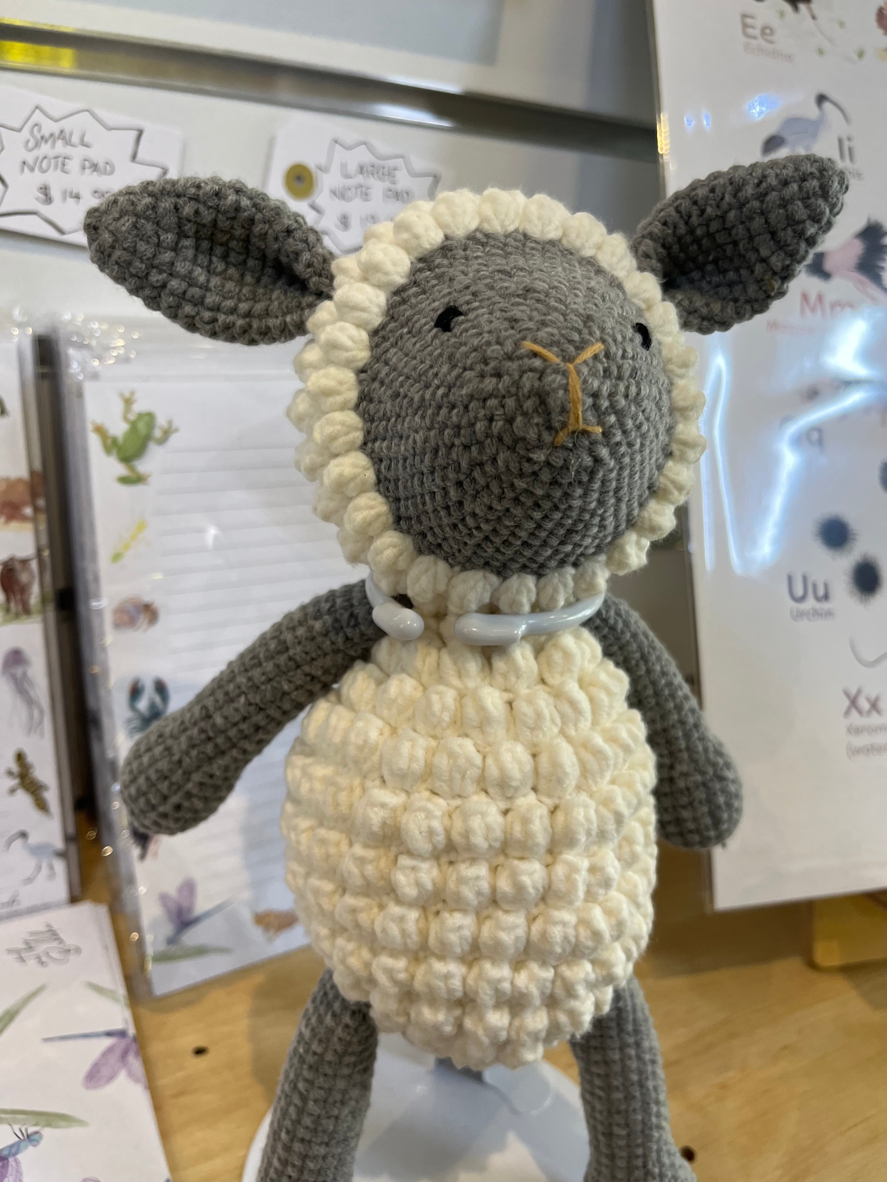 Suzie's Sunshine Dolls handmade grey crochet lamb with cream bobble stitch belly and collar, grey ears and face.