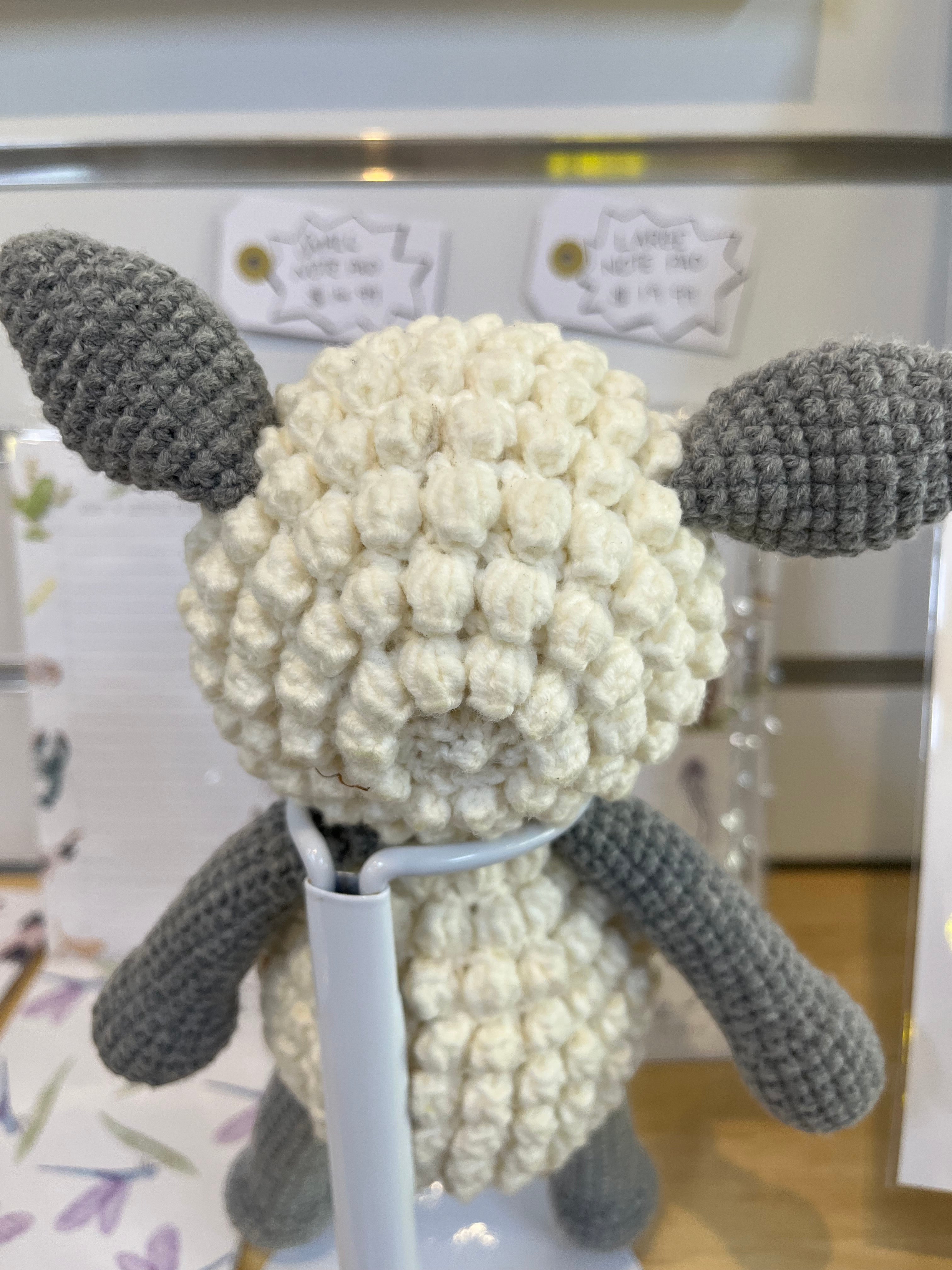Suzie's Sunshine Dolls handmade crochet lamb toy, cream body with bobble texture, grey ears and limbs. Approx. 22cm tall.