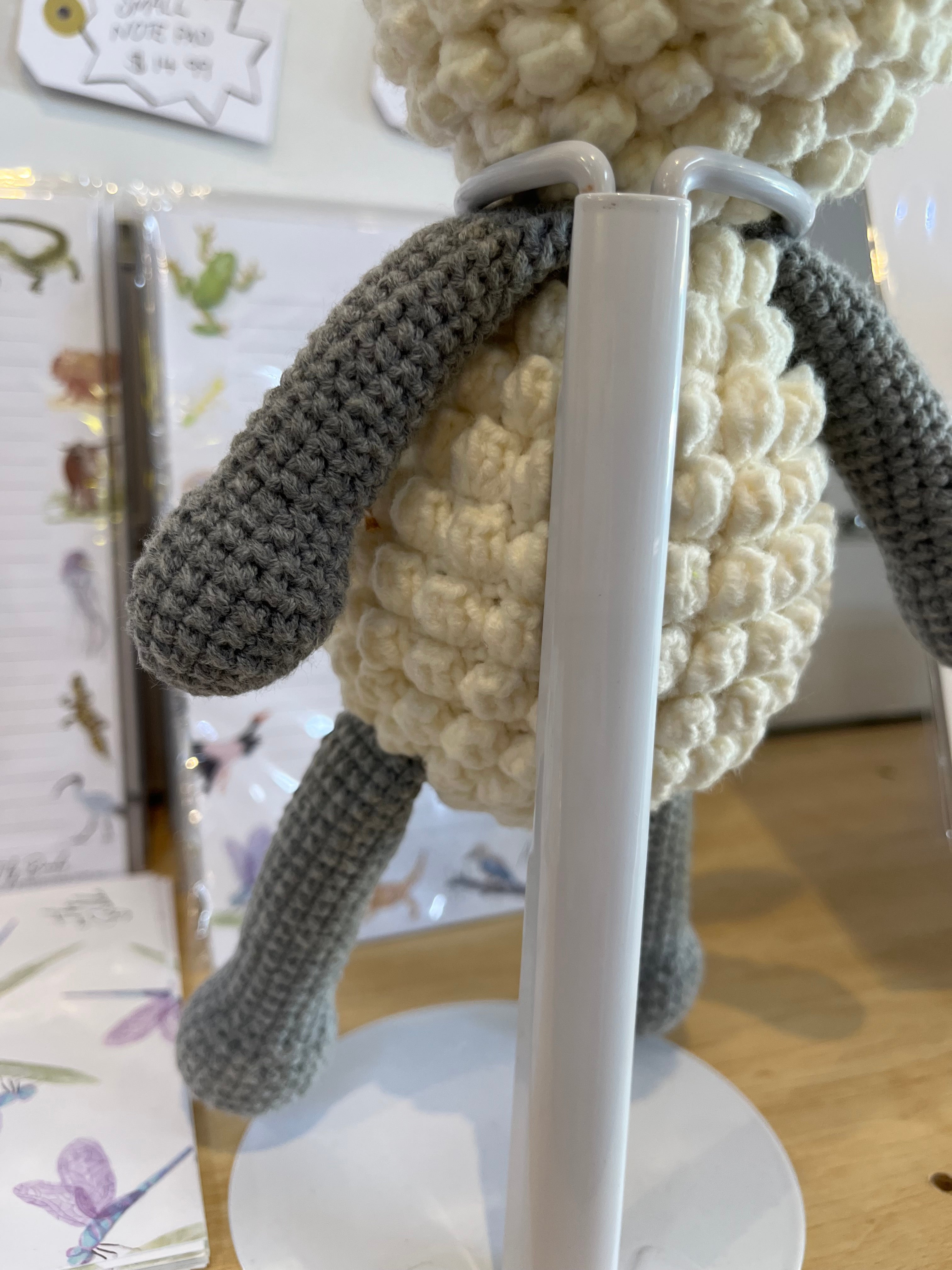 Suzie's Sunshine Dolls handmade crochet lamb toy with cream bobble stitch body and grey arms and legs.
