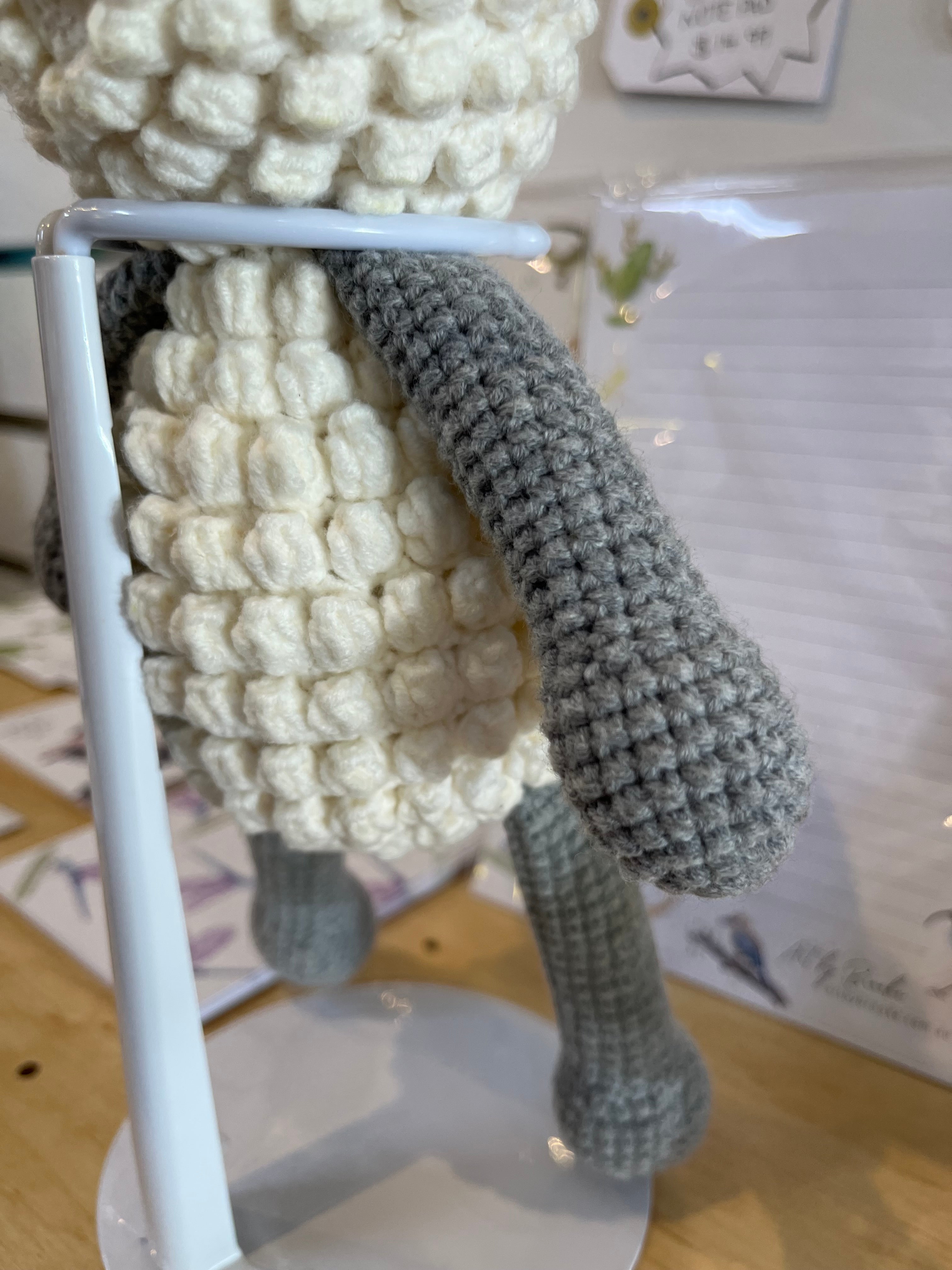 Suzie's Sunshine Dolls handmade crochet lamb toy, white bobble-stitched body, grey legs and face, approx. 22cm tall.