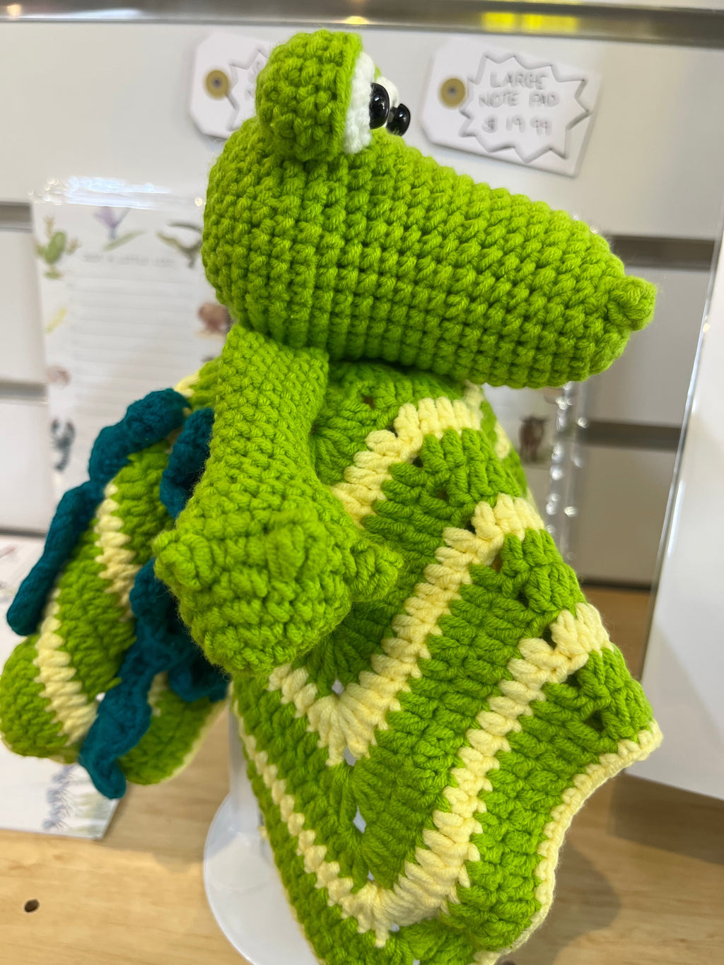 Suzie's Sunshine Dolls Kasabian the Croc lovey blanket, green and cream crochet with teal accents.