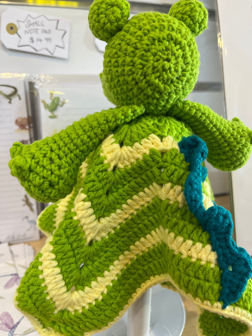 Suzie's Sunshine Dolls Kasabian the Croc lovey blanket, green and cream striped crochet with teal accents.