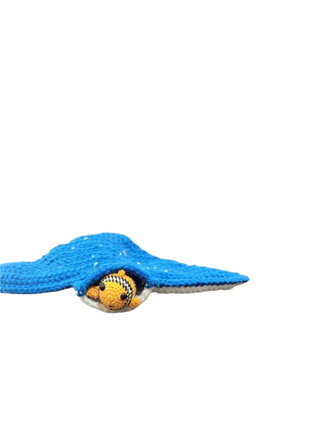 Suzie's Sunshine Dolls Morris the Mantaray crochet toy with Nemo the clownfish peeking out. Blue manta ray with white speckles.