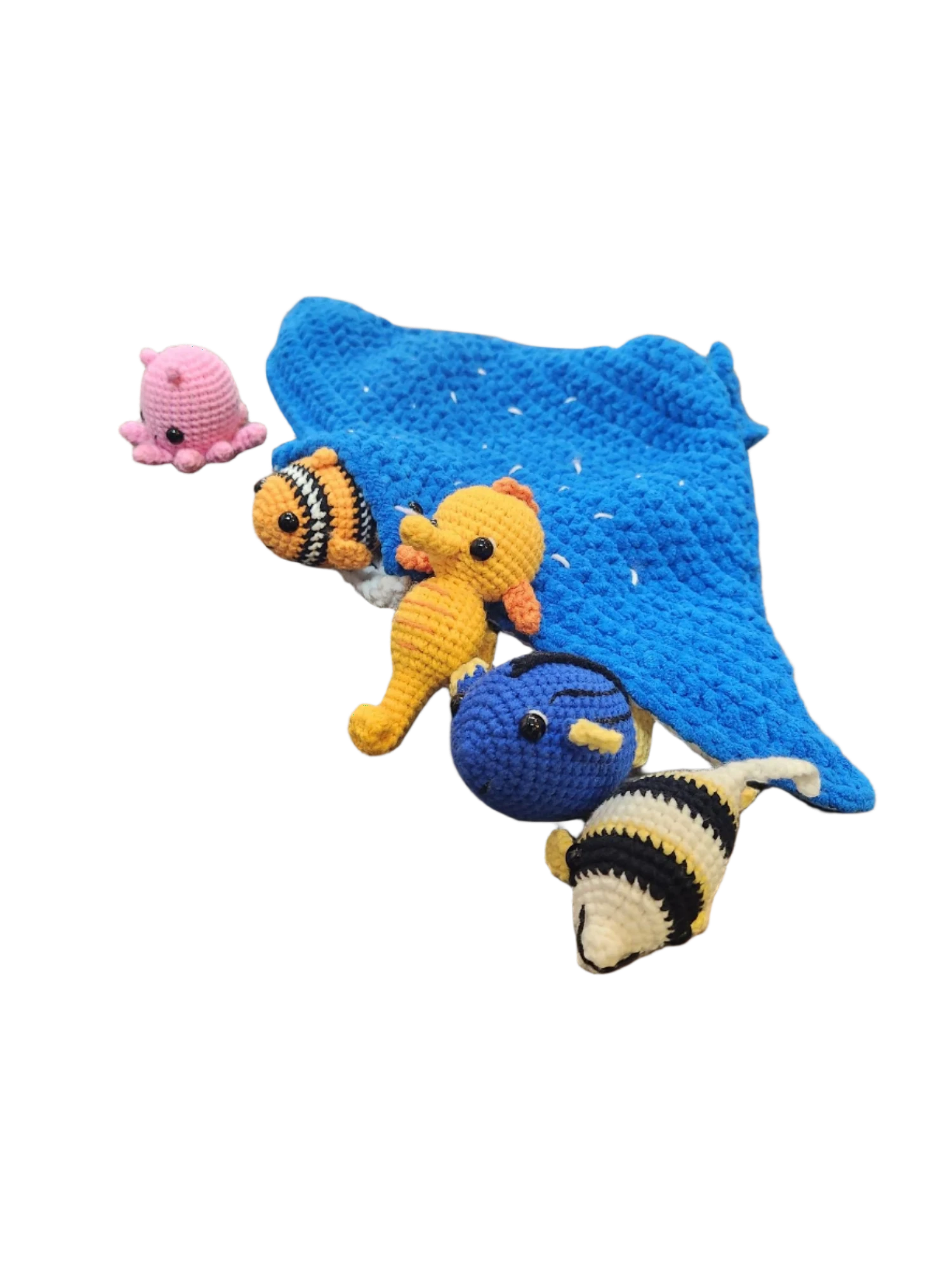 Suzie's Sunshine Dolls Morris the Mantaray and Friends crochet set: blue manta, pink octopus, yellow seahorse, blue tang, clownfish, and striped fish.