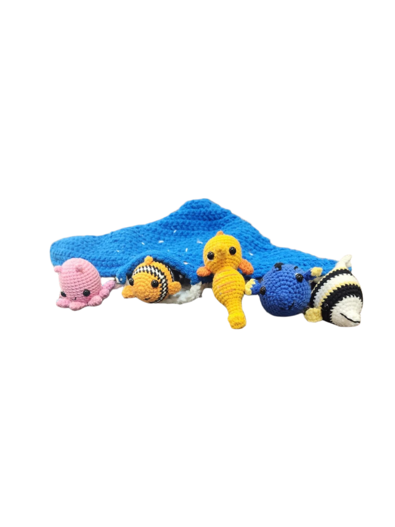 Suzie's Sunshine Dolls crochet manta ray with Nemo clownfish, pink octopus, yellow seahorse, blue tang, and striped fish.
