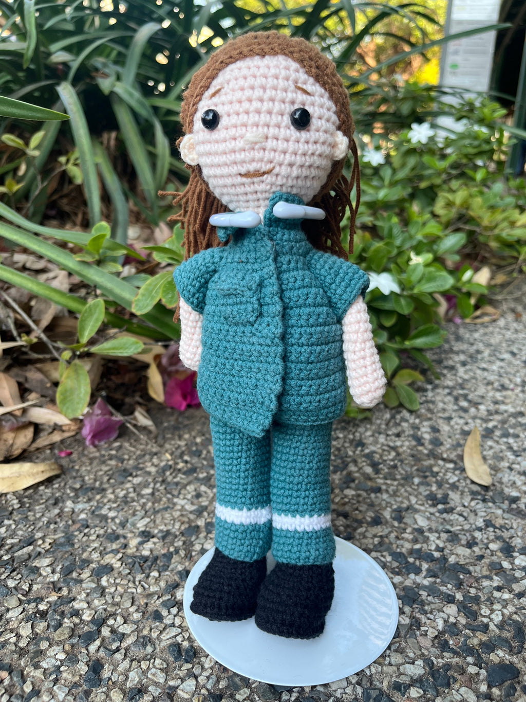 Suzie's Sunshine Dolls crochet paramedic doll in green uniform with reflective stripes and black boots. Handmade in Australia.