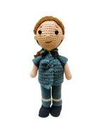 Suzie's Sunshine Dolls crochet paramedic doll in teal uniform with white stripes on legs and black boots.