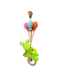 Suzie's Sunshine Dolls green crocheted Kitty the Croc pram toy with pastel balloons and wooden rattle clip.