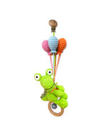Suzie's Sunshine Dolls green crocheted Kitty the Croc pram toy with pastel balloons and wooden rattle clip.