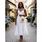 Suzie's Sunshine Dolls handmade crochet sunflower bag in white, yellow, and light green with shoulder straps.