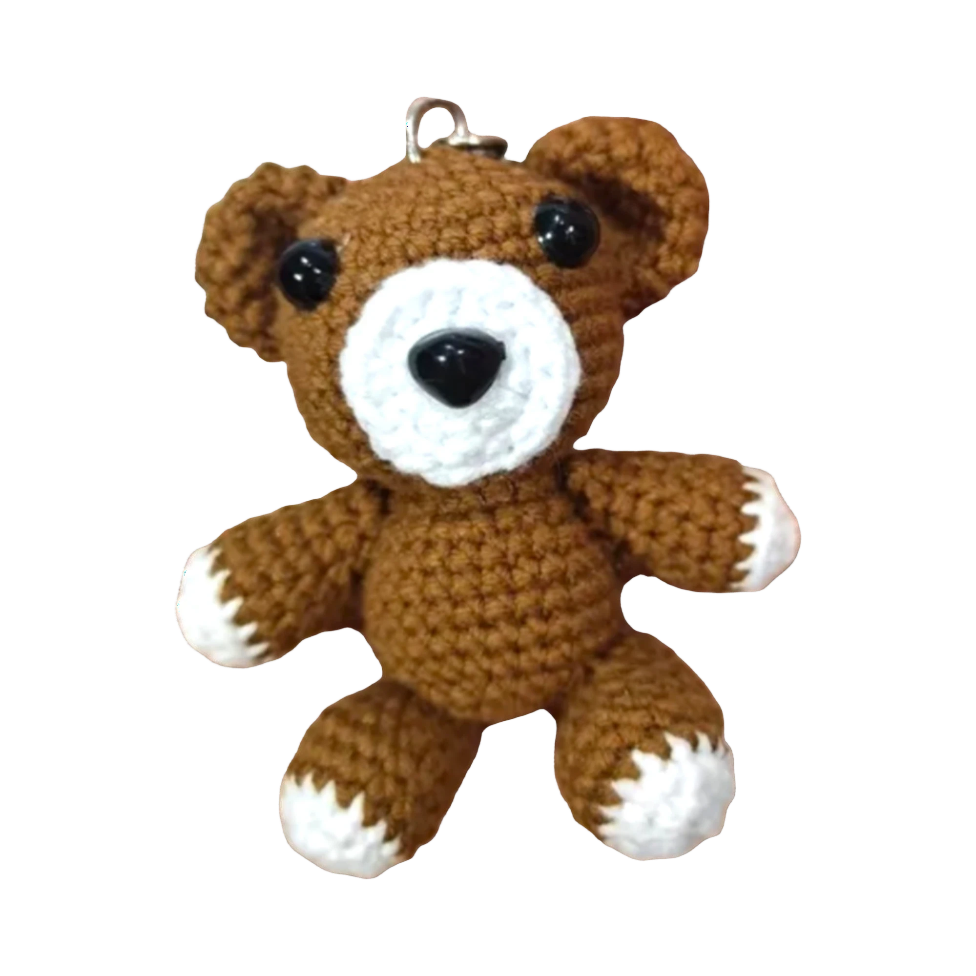 Suzie's Sunshine Dolls brown crochet teddy bear keychain with white accents and black eyes.