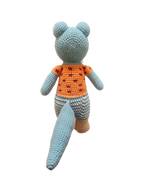 Suzie's Sunshine Dolls Calvin the Croc, a handmade crochet toy with a blue body, orange shirt, and blue & white striped pants.