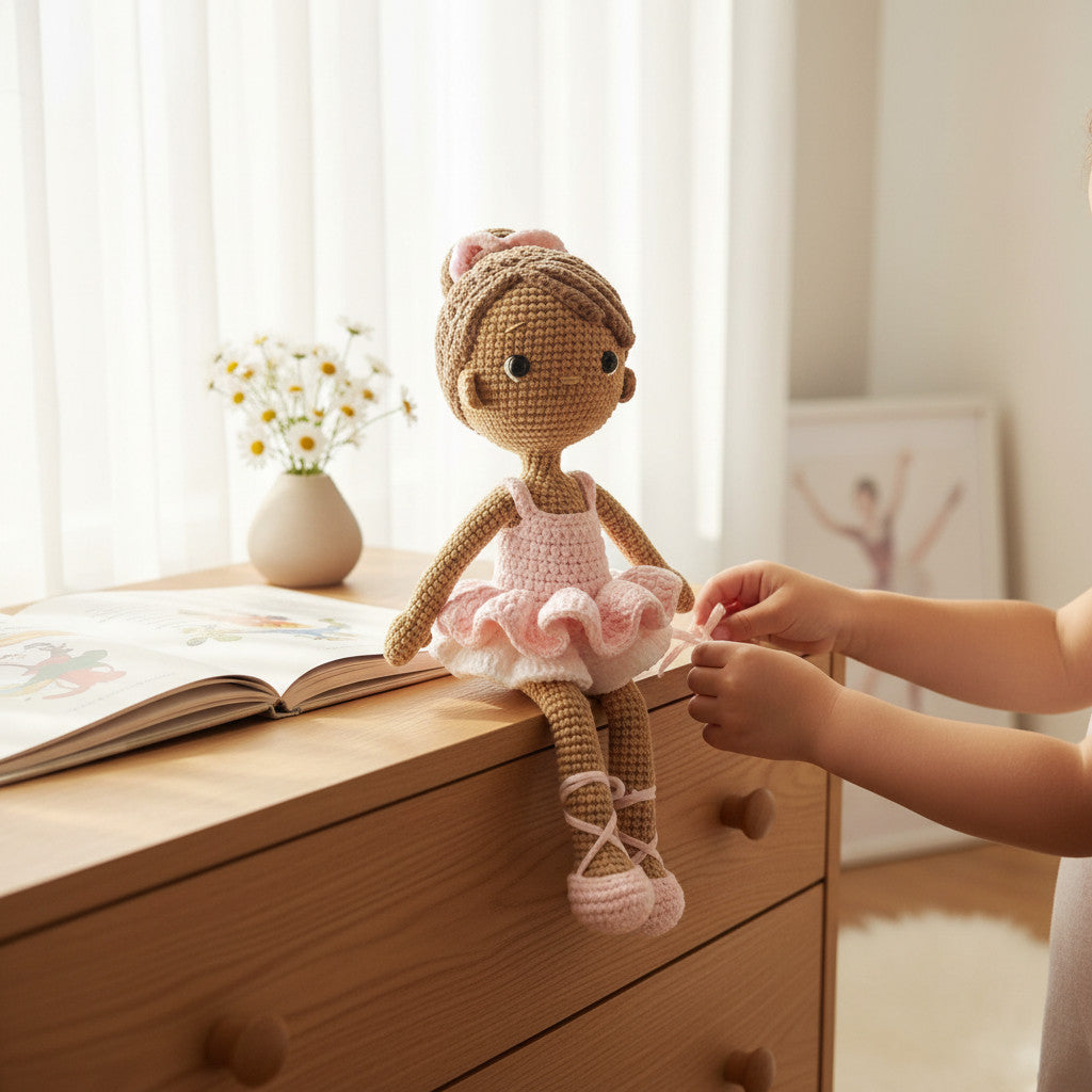 Suzie's Sunshine Dolls crocheted ballerina doll with pink tutu and ballet slippers, brown hair with bow.