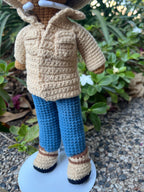 Suzie's Sunshine Dolls crocheted cowboy doll in tan jacket, blue jeans, and boots with a wide-brimmed hat.