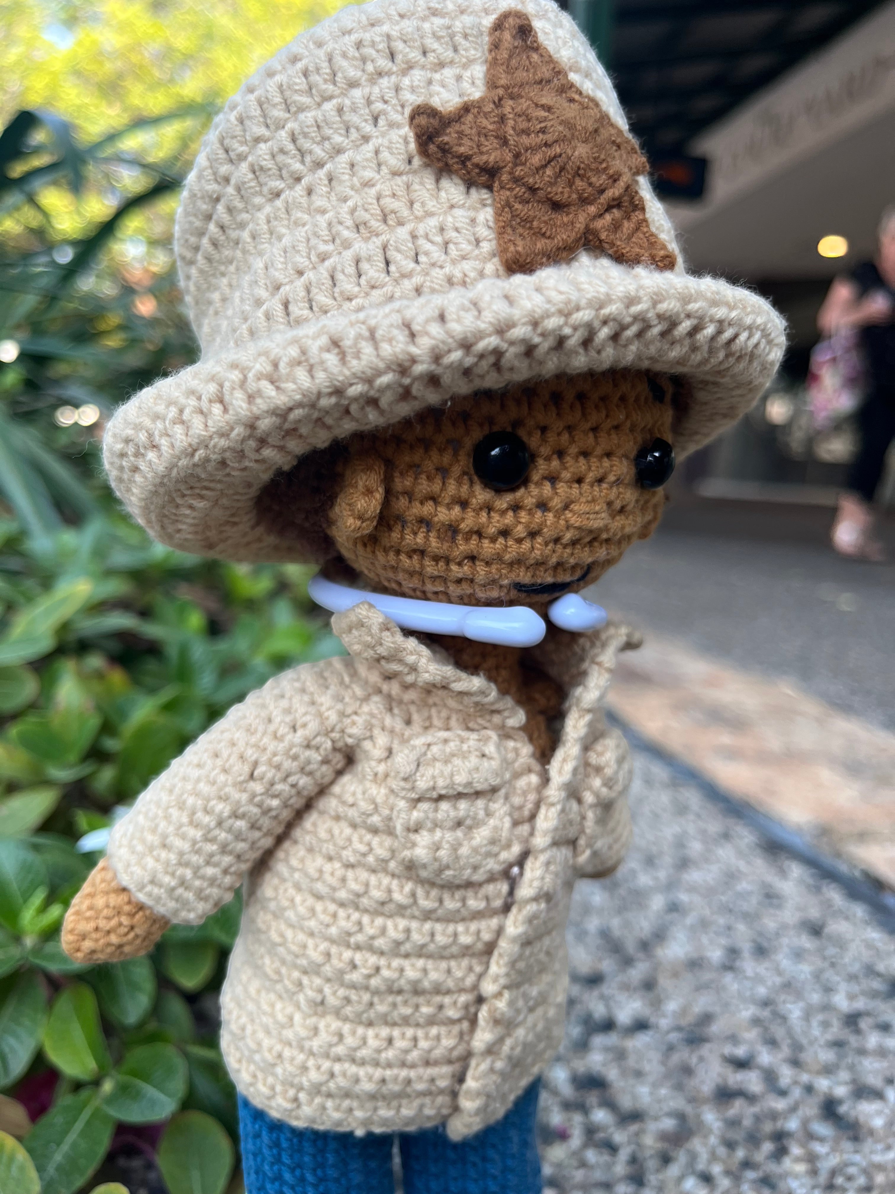 Suzie's Sunshine Dolls crocheted cowboy/cowgirl doll in tan jacket, blue jeans, and tan hat with star detail.