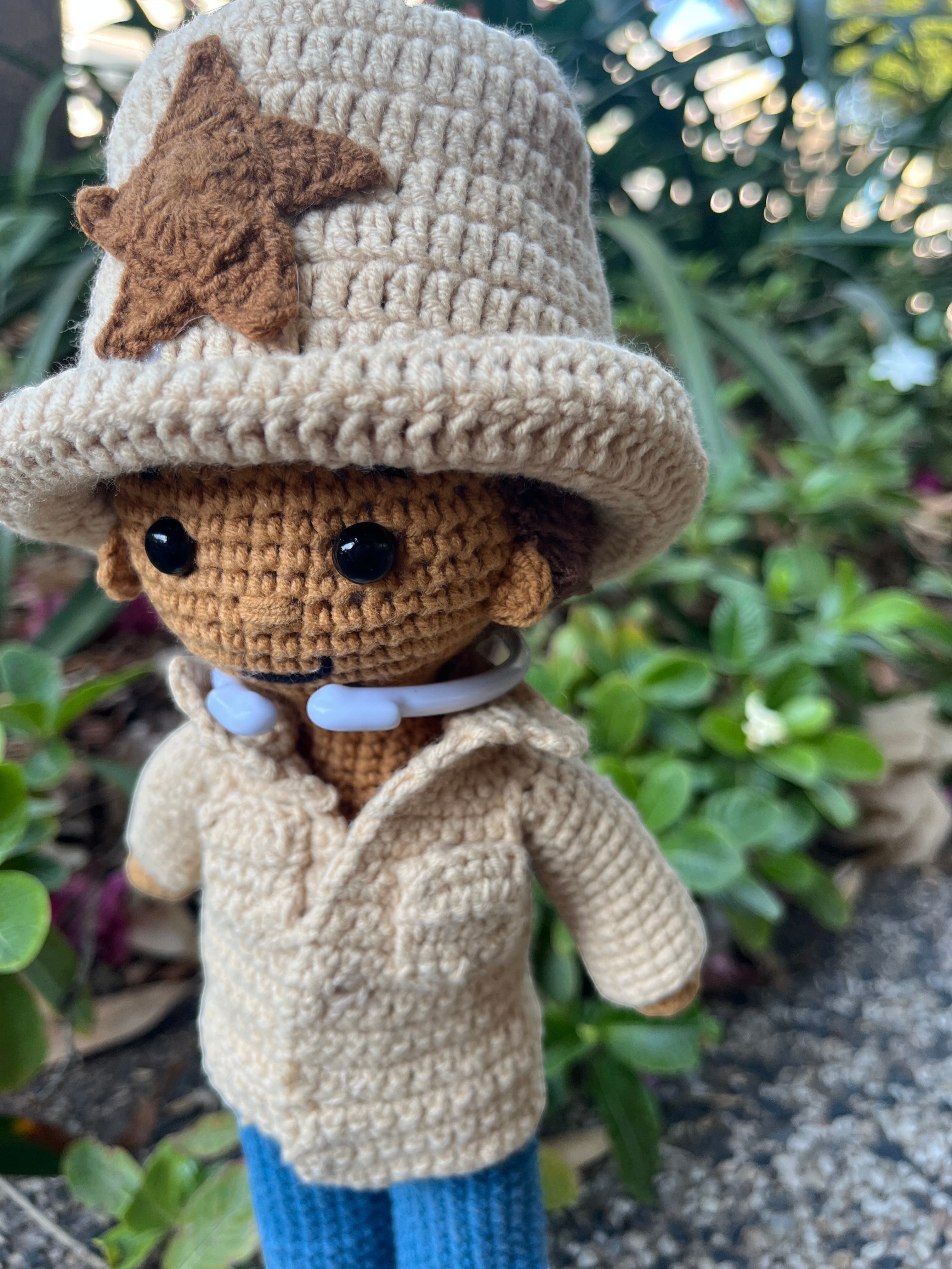 Suzie's Sunshine Dolls crocheted cowboy doll in tan shirt, blue jeans, and tan hat with brown star detail.