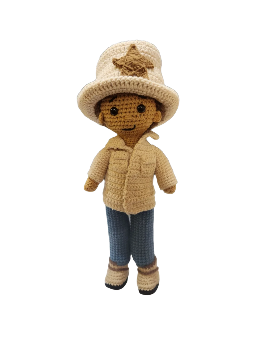 Suzie's Sunshine Dolls handmade crocheted doll dressed as a cowboy/cowgirl with a tan jacket, blue jeans, and a cream hat with a star badge.