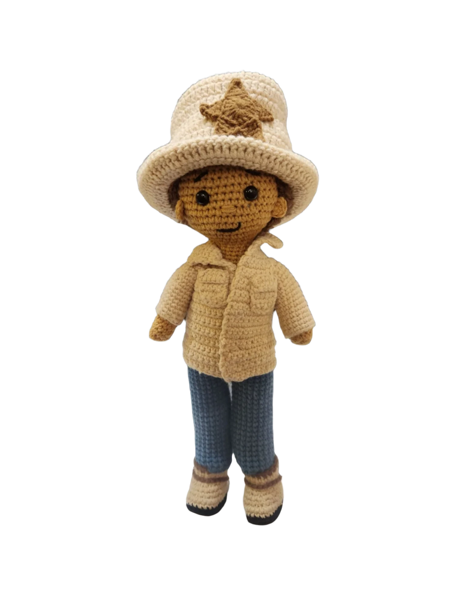 Suzie's Sunshine Dolls handmade crocheted doll dressed as a cowboy/cowgirl with a tan jacket, blue jeans, and a cream hat with a star badge.